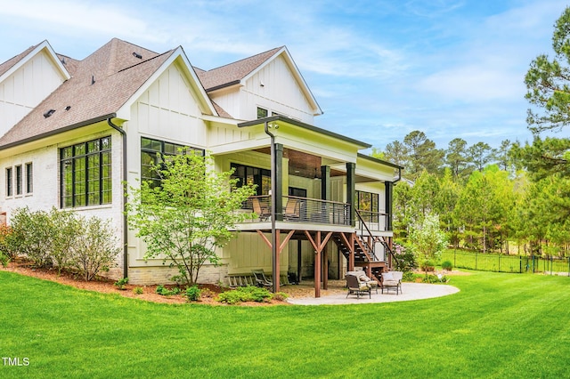 5040 Shakori Trl, Chapel Hill, NC 27707 - back of property featuring board and batten siding, a patio area, fence, a yard, and stairs