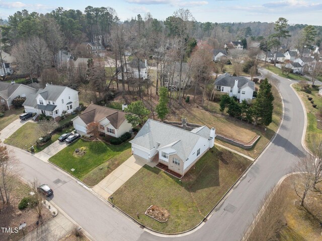 birds eye view of property with a residential view