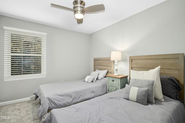 bedroom featuring ceiling fan, carpet floors, and baseboards