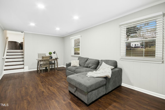 living room featuring stairs, wood finished floors, and crown molding