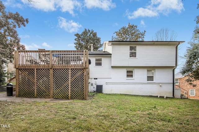 back of house with central AC unit, a lawn, crawl space, a deck, and brick siding