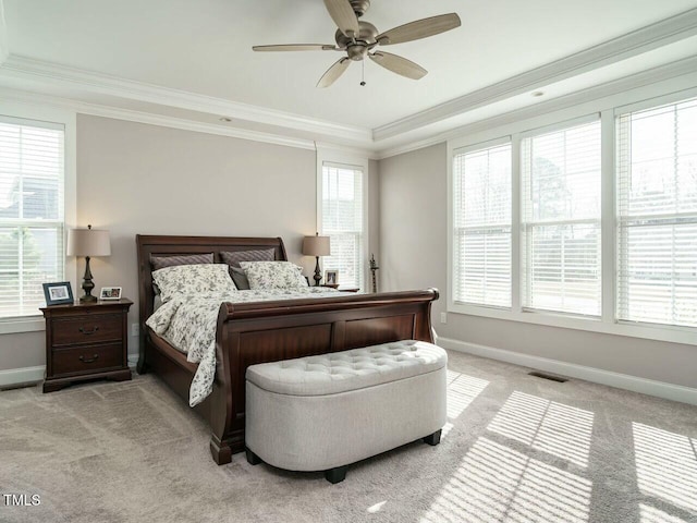 bedroom with light carpet, ornamental molding, visible vents, and baseboards