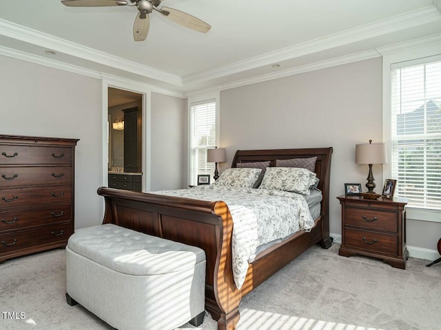 bedroom featuring multiple windows, crown molding, and light colored carpet