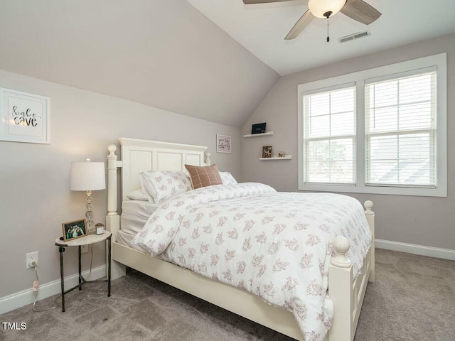 bedroom featuring baseboards, visible vents, a ceiling fan, light colored carpet, and vaulted ceiling