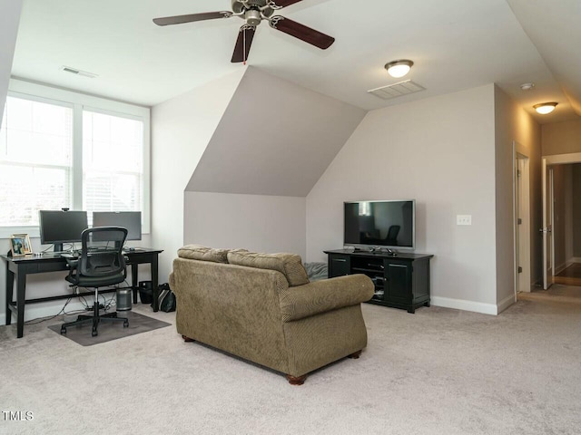 living area with carpet floors, baseboards, visible vents, and lofted ceiling