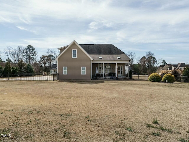 back of property with a patio area and fence