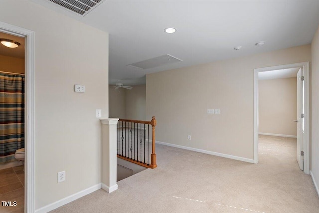 corridor featuring recessed lighting, carpet floors, visible vents, an upstairs landing, and baseboards