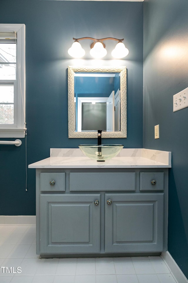 bathroom featuring vanity and baseboards