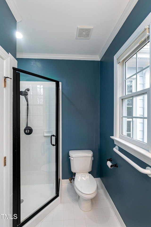 bathroom featuring visible vents, a stall shower, and crown molding