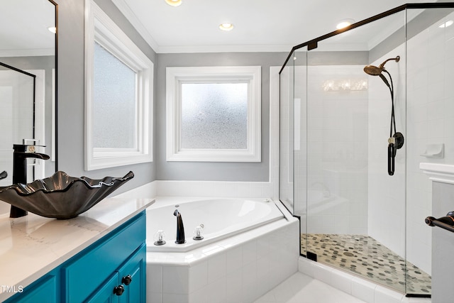 full bathroom with vanity, ornamental molding, a shower stall, and a bath