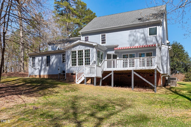 rear view of house featuring stairway, a lawn, a deck, and central AC unit