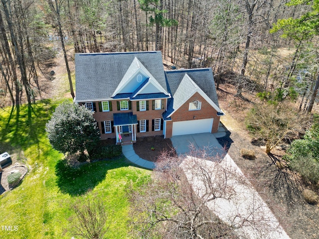 bird's eye view featuring a forest view