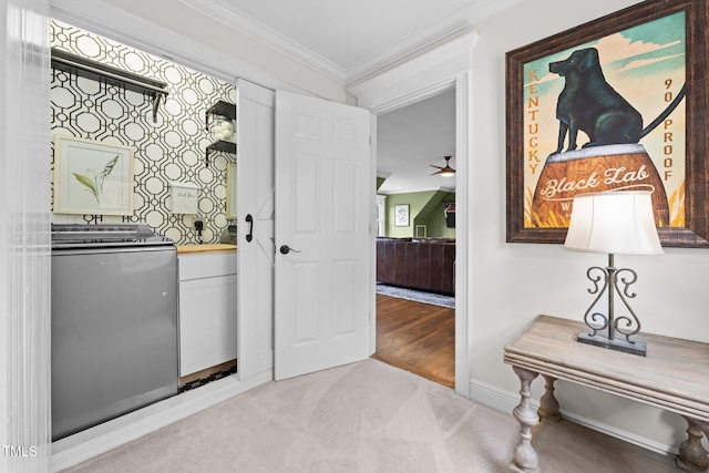 bar with ceiling fan, light colored carpet, baseboards, ornamental molding, and washer / clothes dryer