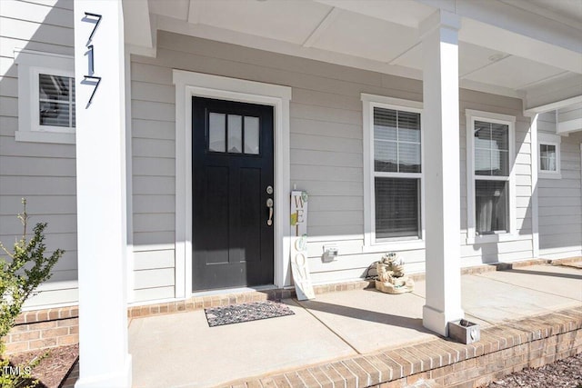 property entrance with covered porch