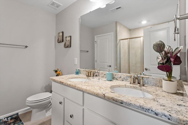 bathroom featuring a sink, visible vents, and a shower stall