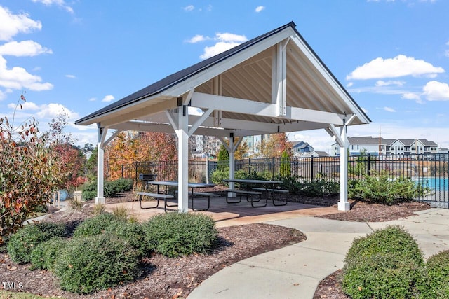 view of property's community featuring fence and a gazebo