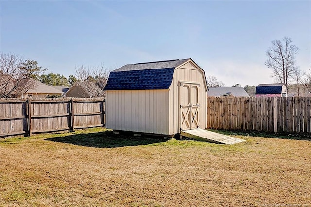 view of shed with a fenced backyard