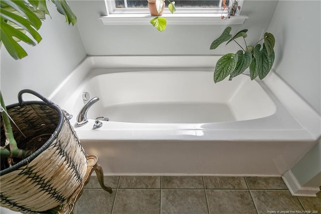 bathroom featuring a bath and tile patterned floors