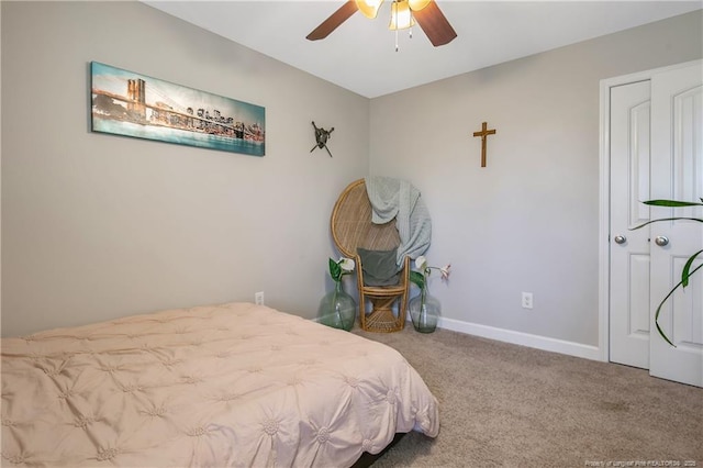 bedroom featuring ceiling fan, carpet flooring, and baseboards