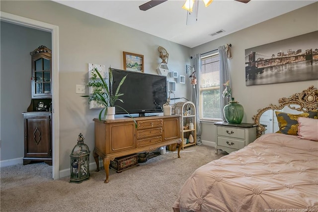 bedroom featuring a ceiling fan, carpet flooring, visible vents, and baseboards