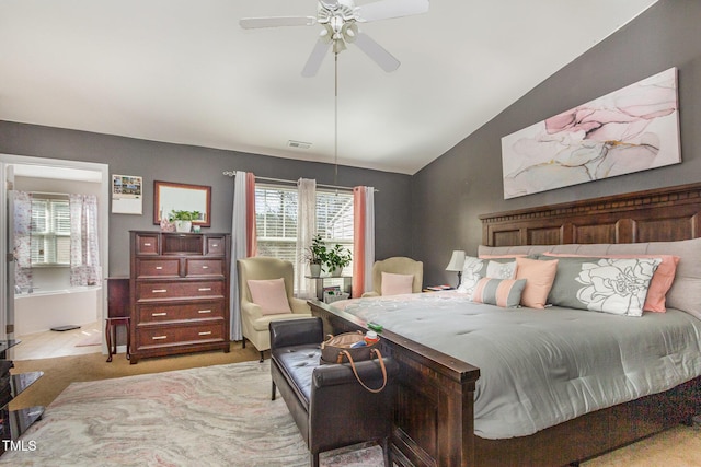 carpeted bedroom featuring lofted ceiling, ceiling fan, and visible vents