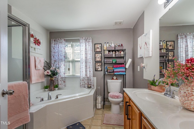 11843 Canemount St, Raleigh, NC 27614 - full bathroom featuring a sink, toilet, double vanity, visible vents, and a garden tub