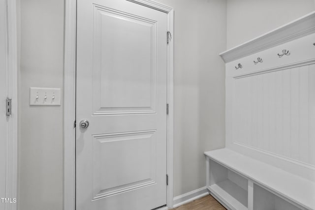 mudroom with light wood-type flooring and baseboards