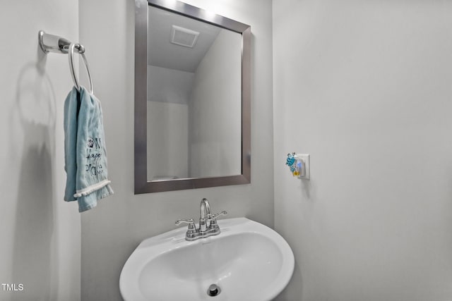 bathroom with visible vents and a sink