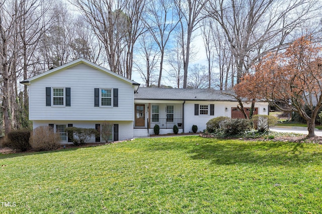 tri-level home with a front lawn