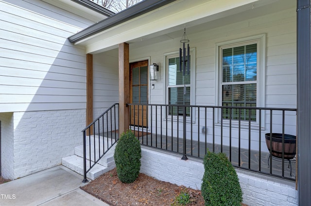 property entrance with covered porch