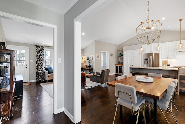 dining area featuring baseboards, recessed lighting, dark wood-type flooring, vaulted ceiling, and a notable chandelier