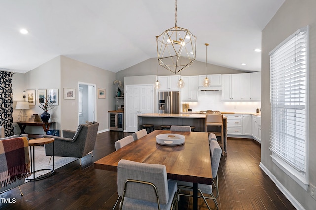 dining space featuring plenty of natural light, a notable chandelier, lofted ceiling, and dark wood finished floors