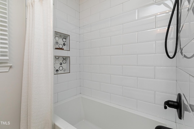 bathroom with shower / bathtub combination with curtain