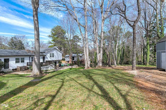 view of yard with a wooden deck