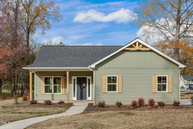 view of front of house with covered porch and roof with shingles