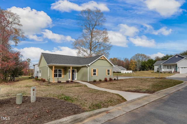 ranch-style home with a front yard and driveway