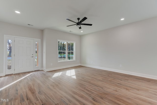 foyer entrance featuring a ceiling fan, baseboards, wood finished floors, and recessed lighting