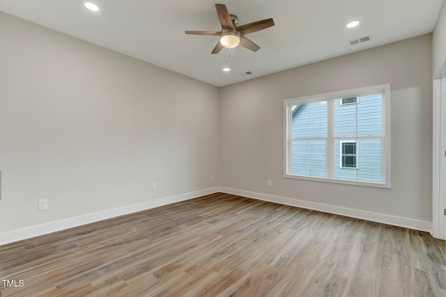 unfurnished room with ceiling fan, recessed lighting, visible vents, baseboards, and light wood-type flooring