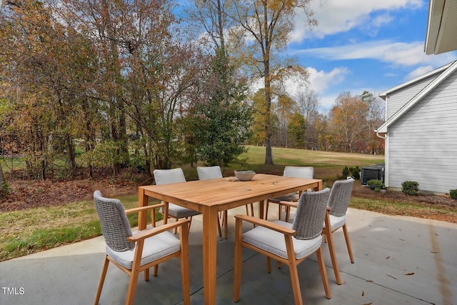 view of patio with outdoor dining space and cooling unit