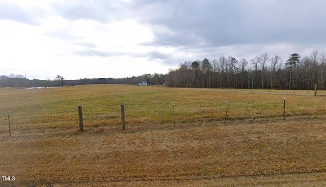 view of yard with a rural view