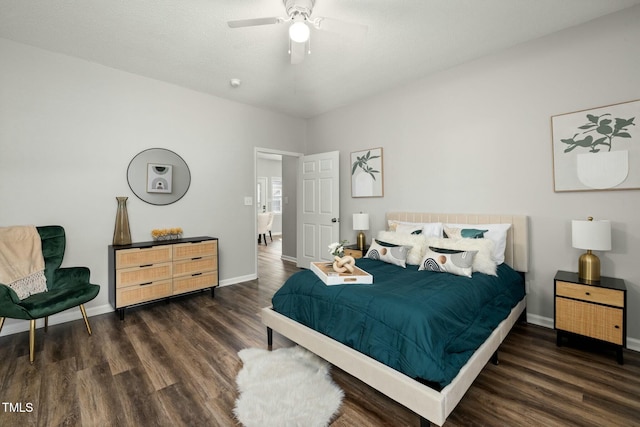 bedroom featuring ceiling fan, wood finished floors, and baseboards