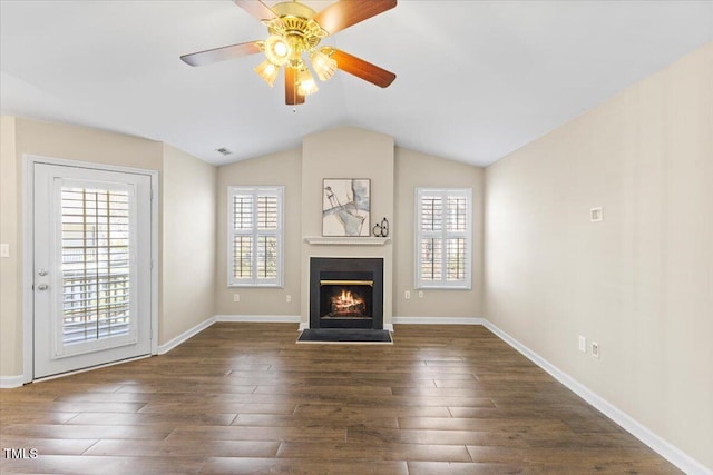 unfurnished living room featuring wood finished floors and a healthy amount of sunlight