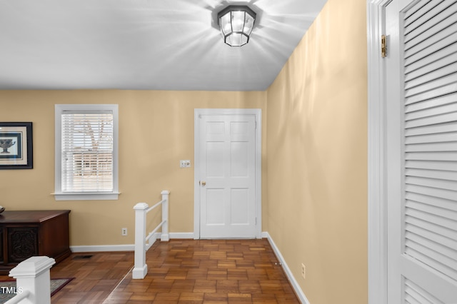 entryway featuring baseboards