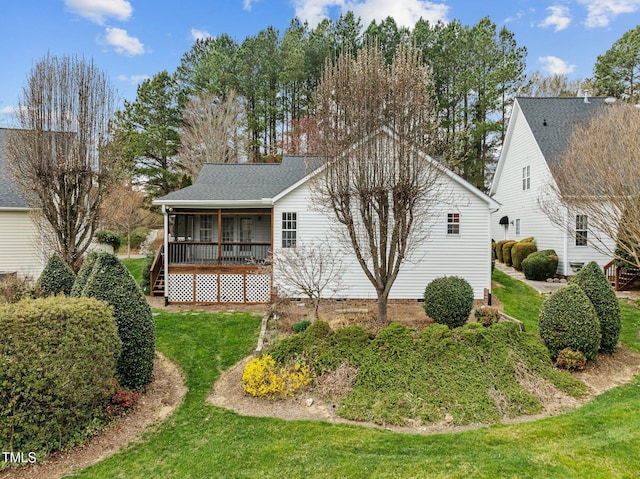 view of property exterior with a lawn and a sunroom