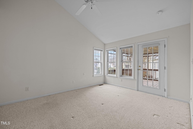 spare room featuring carpet, a healthy amount of sunlight, baseboards, and ceiling fan