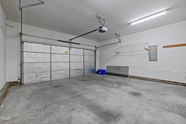 garage featuring electric panel and a garage door opener