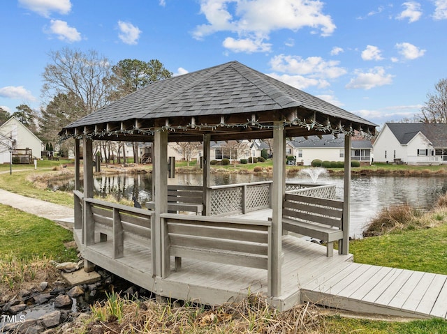 dock area with a gazebo and a water view