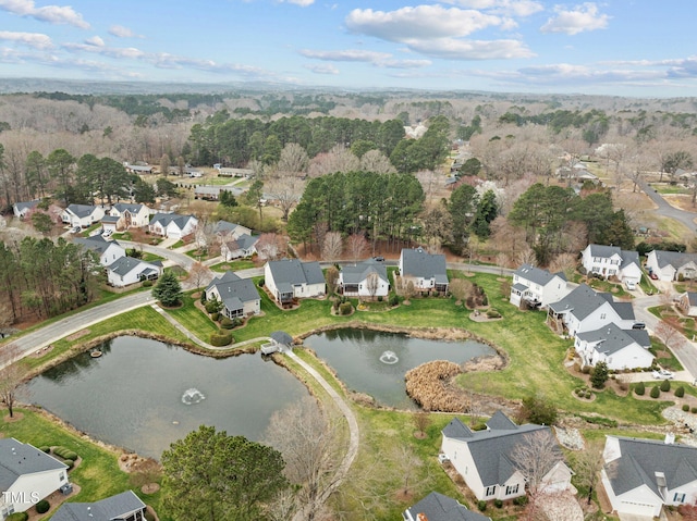 drone / aerial view with a residential view and a water view