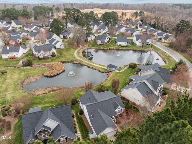 aerial view with a residential view and a water view