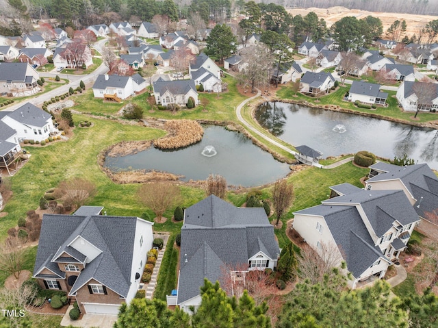 birds eye view of property with a residential view and a water view